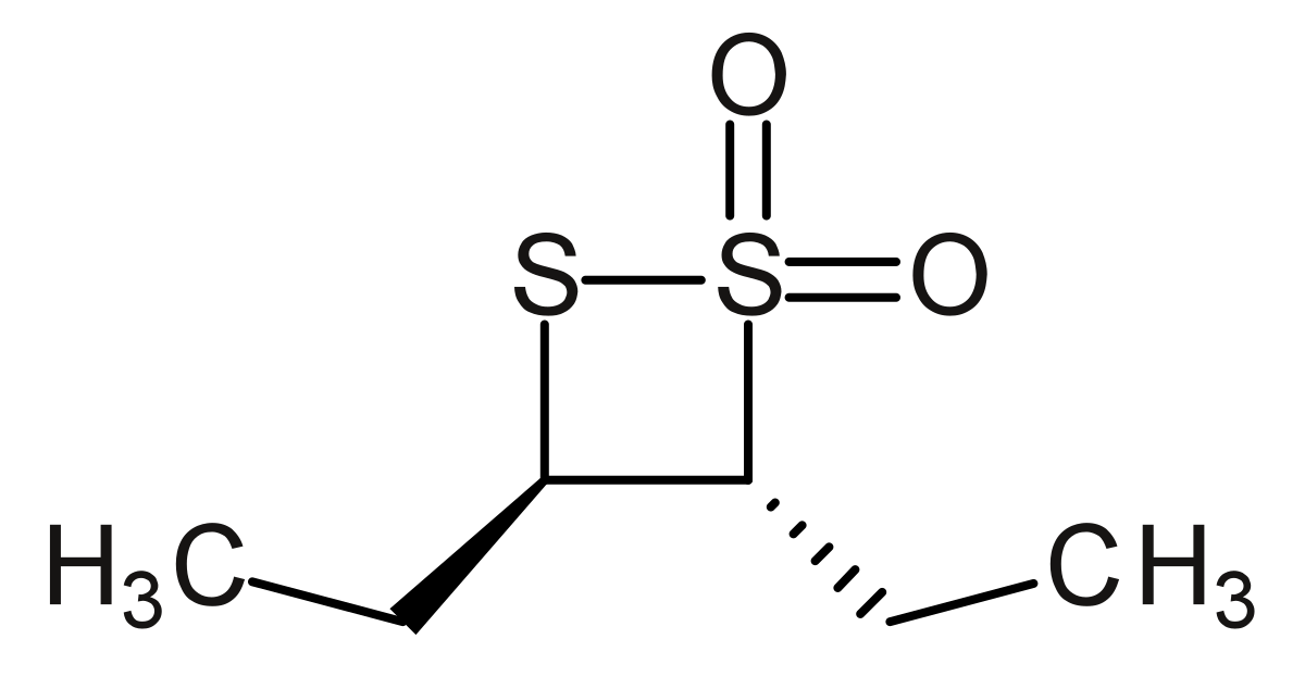 Structural formula of trans-3,4-diethyl-1,2-dithietane 1,1-dioxide, a cyclic compound with a four-membered ring containing two sulfur atoms and two carbon atoms. One sulfur atom is double-bonded to two oxygen atoms, and the carbon atoms are bonded to ethyl groups (CH3) in a trans configuration.
