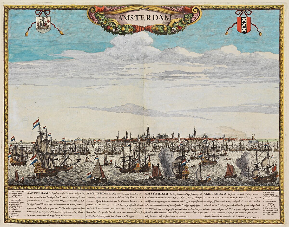 A panoramic historical map titled "Amsterdam vanaf het IJ Panorama 1699 Frederik de Wit" shows a view of Amsterdam from the IJ river in 1699. The cityscape features numerous ships with Dutch flags, prominent buildings, and decorative borders with coats of arms and a title cartouche.