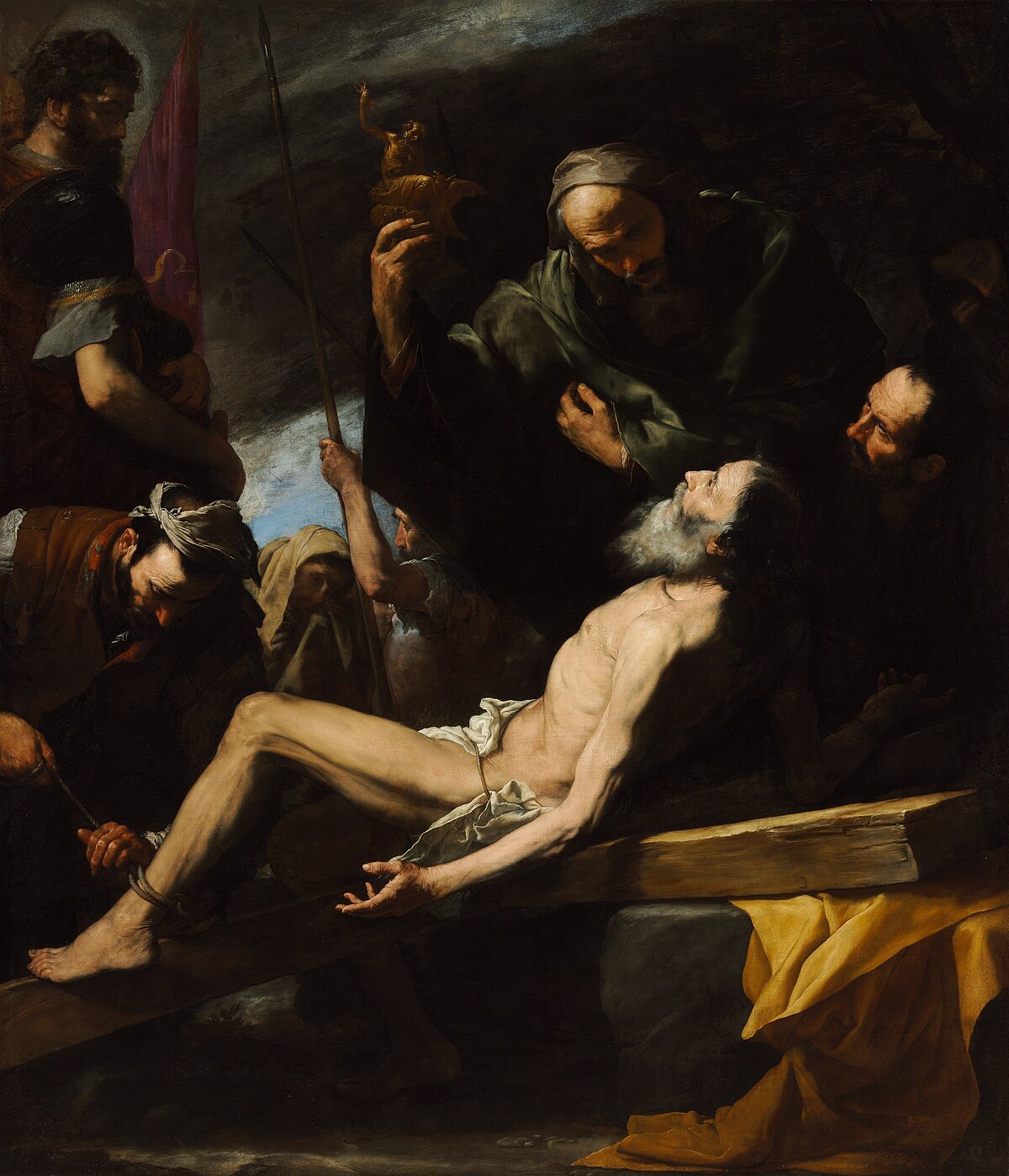 An oil painting by Jusepe de Ribera, titled "Martyrdom of St Andrew," created in 1628 and housed in the Museum of Fine Arts, Budapest. The painting uses strong tenebrism to depict the martyrdom, with St. Andrew on a cross, surrounded by figures in dramatic light and shadow.