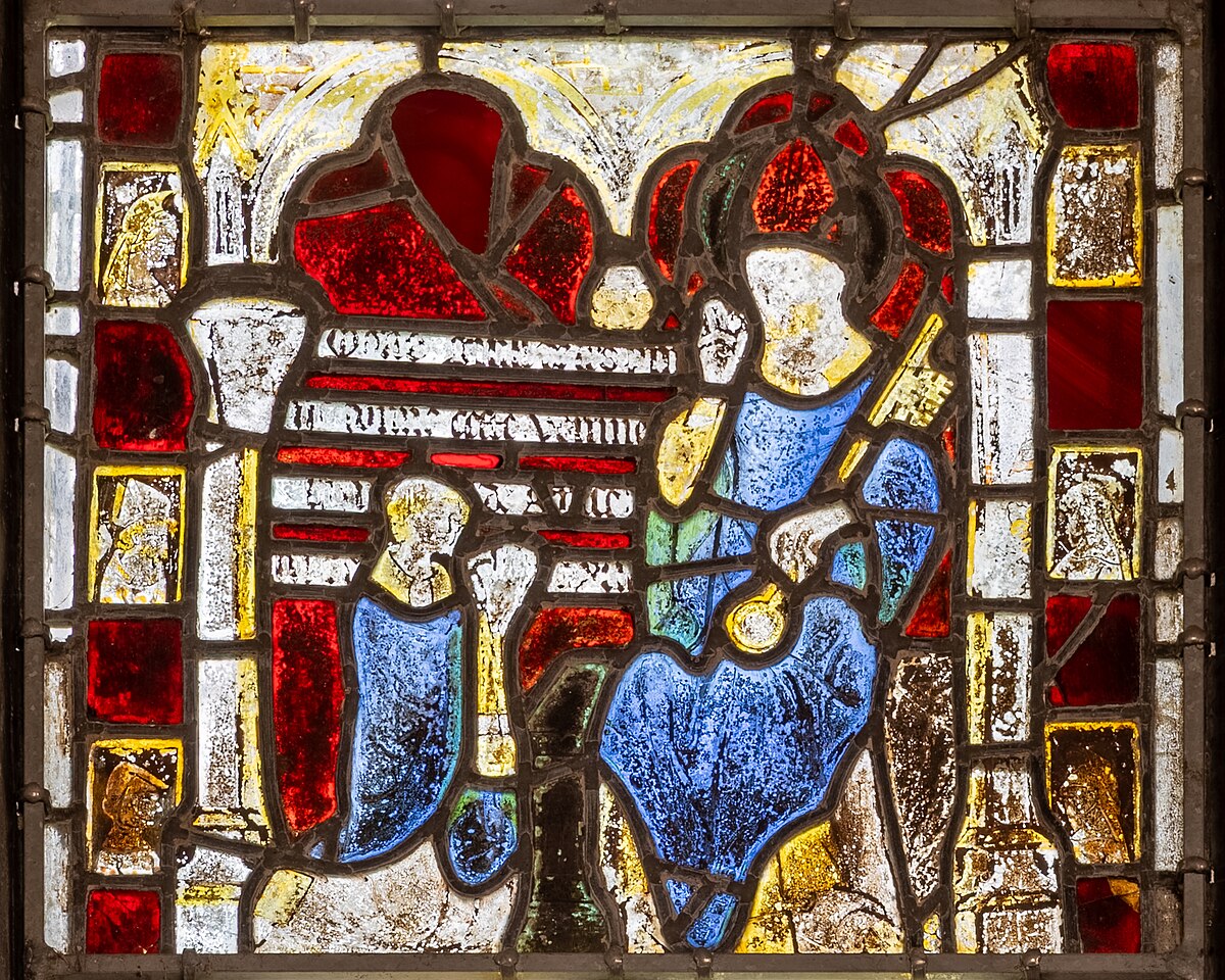 A stained glass panel from 1313, depicting Saint Peter receiving a key from a kneeling donor, showcasing early use of silver stain. Saint Peter, wearing a blue tunic and red cloak, holds a large key, while the smaller donor kneels before him.