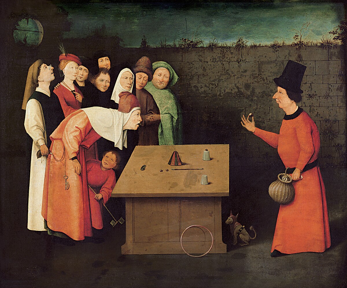Hieronymus Bosch's painting "The Conjurer" (1475–1480) depicts a magician performing a cup-and-ball trick for a captivated audience, while a pickpocket on the far left, in cahoots with the conjurer, steals a purse from a distracted spectator. The scene includes various onlookers, some with expressions of awe or amusement.