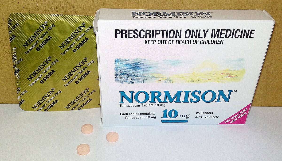 A box of Normison (temazepam) 10 mg tablets, a prescription-only medicine for insomnia, next to a blister pack and three loose tablets. The box indicates "PRESCRIPTION ONLY MEDICINE" and "KEEP OUT OF REACH OF CHILDREN," with each tablet containing "Temazepam 10 mg" and the box containing "25 Tablets."