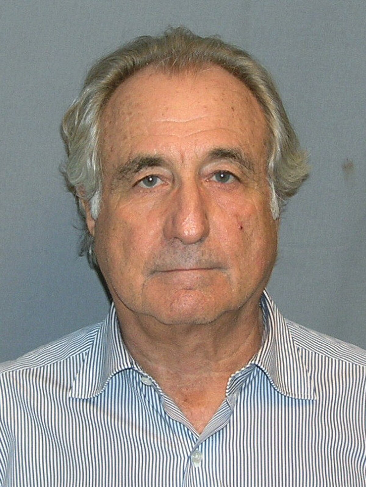 A 2009 mug shot of Bernie Madoff shows him with graying hair and a striped shirt, looking directly at the camera. His expression is neutral.