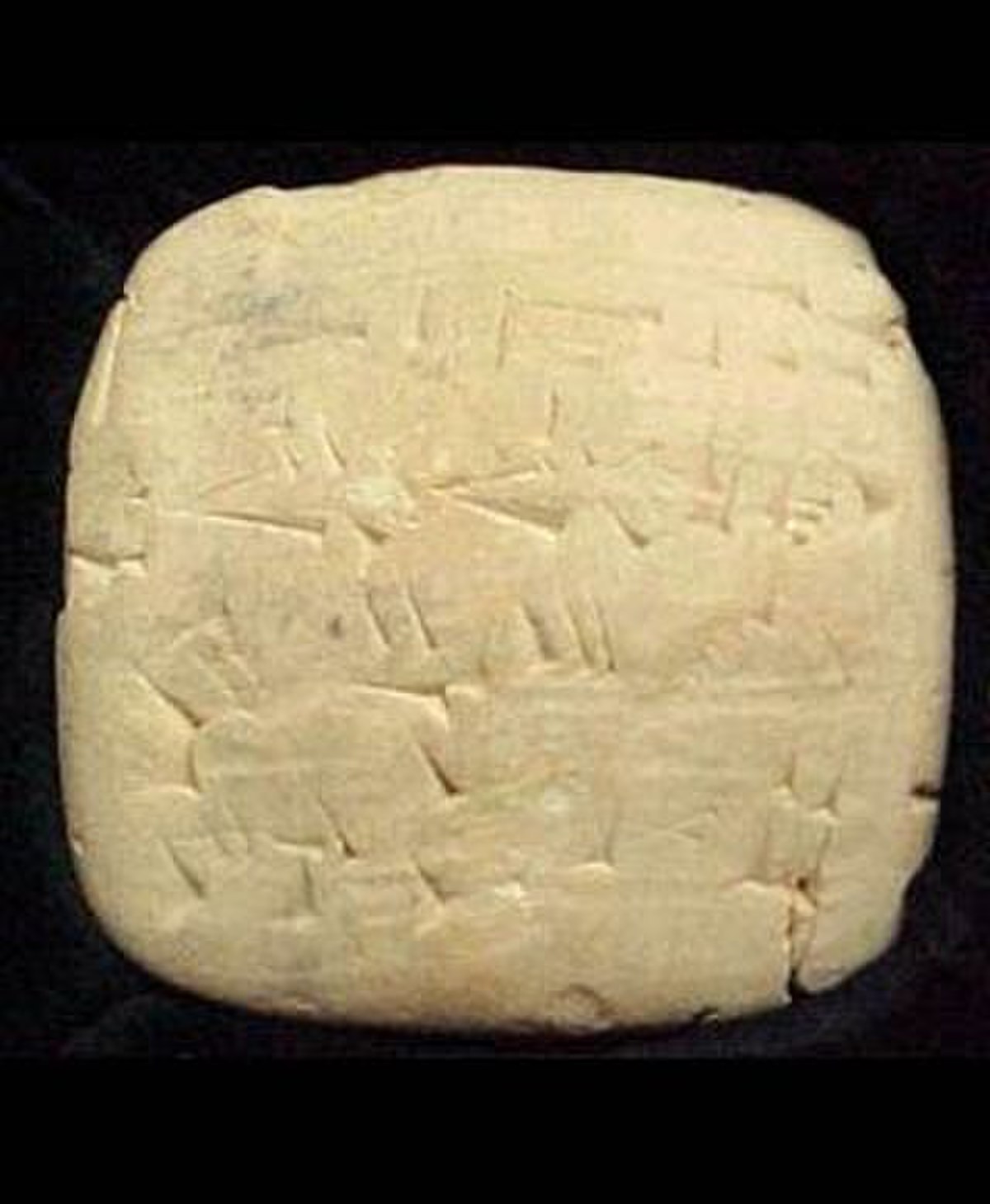 A photograph of the Alulu beer receipt, a cuneiform tablet from the Sumerian city of Umma, dating to approximately 2050 BC. The tablet records a purchase of "best" beer from a brewer.