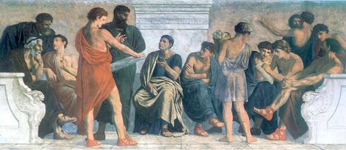 A painting titled "Aristotle's School" by Gustav Adolph Spangenberg from the 1880s shows Aristotle engaging with a group of his students in an outdoor setting.