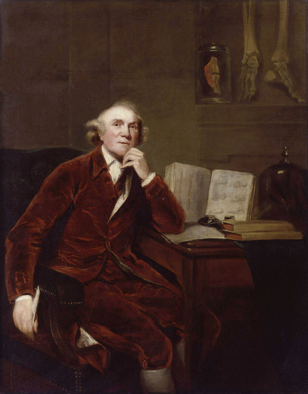 Portrait of John Hunter by John Jackson, showing Hunter seated in a red coat, with his hand to his chin, next to a table with an open book, a jar containing anatomical specimens, and skeletal feet.