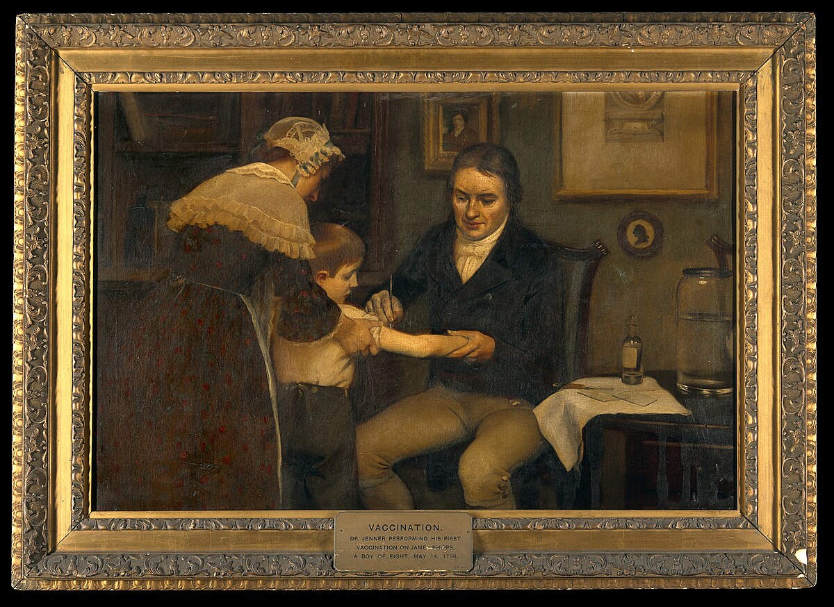 Painting titled "Vaccination" depicting Dr. Jenner performing his first vaccination on a young boy. A woman stands behind the boy, holding him, while Dr. Jenner, seated, administers the vaccine to the boy's left arm. The painting is labeled "VACCINATION: Dr. JENNER PERFORMING HIS FIRST VACCINATION, 1796."